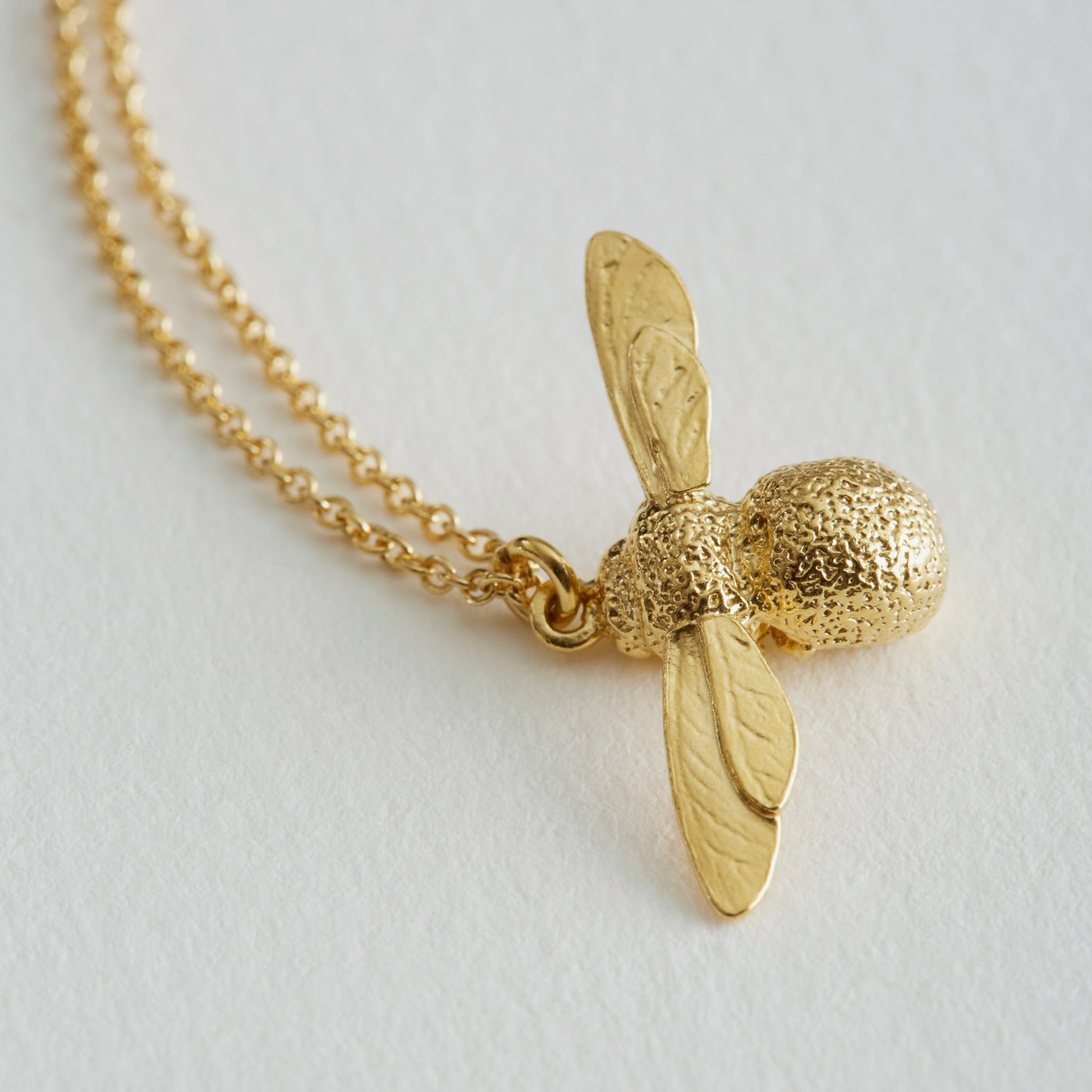 gold baby bee necklace on a gold chain made by Alex Monroe for Kirsty Taylor Goldsmiths Corbridge