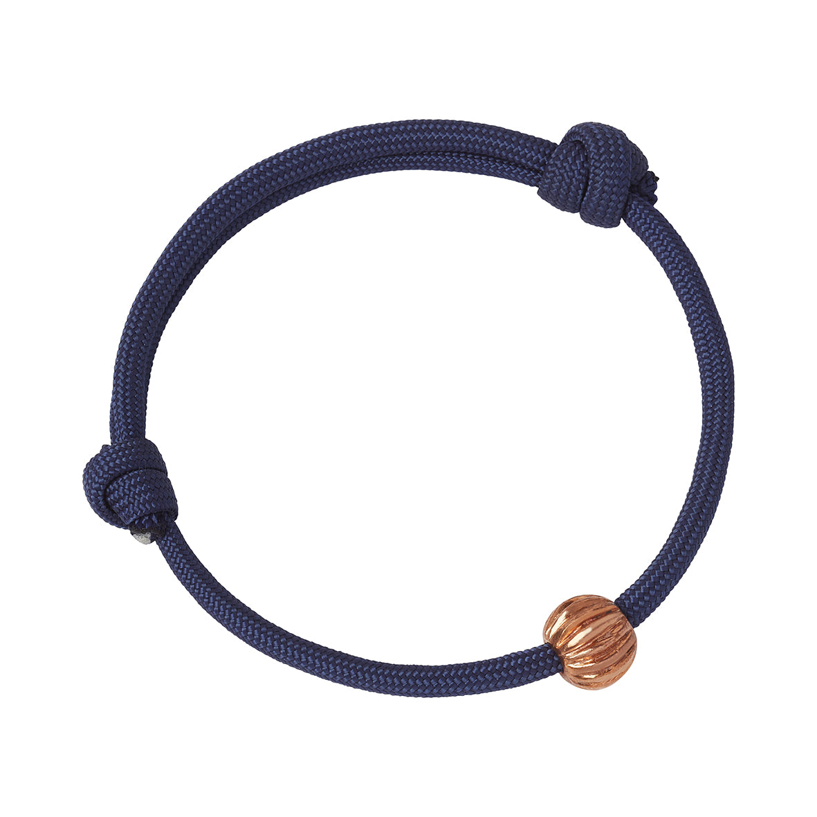 A navy blue adjustable paracord bracelet with a copper round bead with a grooved pattern inspired by the Roman Melon Beads found at Corstopitum in Corbridge, Northumberland. Made by Kirsty Taylor Jewellery