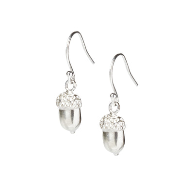 A pair of half acorn sterling silver drop earrings with a silver hook wire on a white background. Handmade in Corbridge, Northumberland by Kirsty Taylor Jewellery