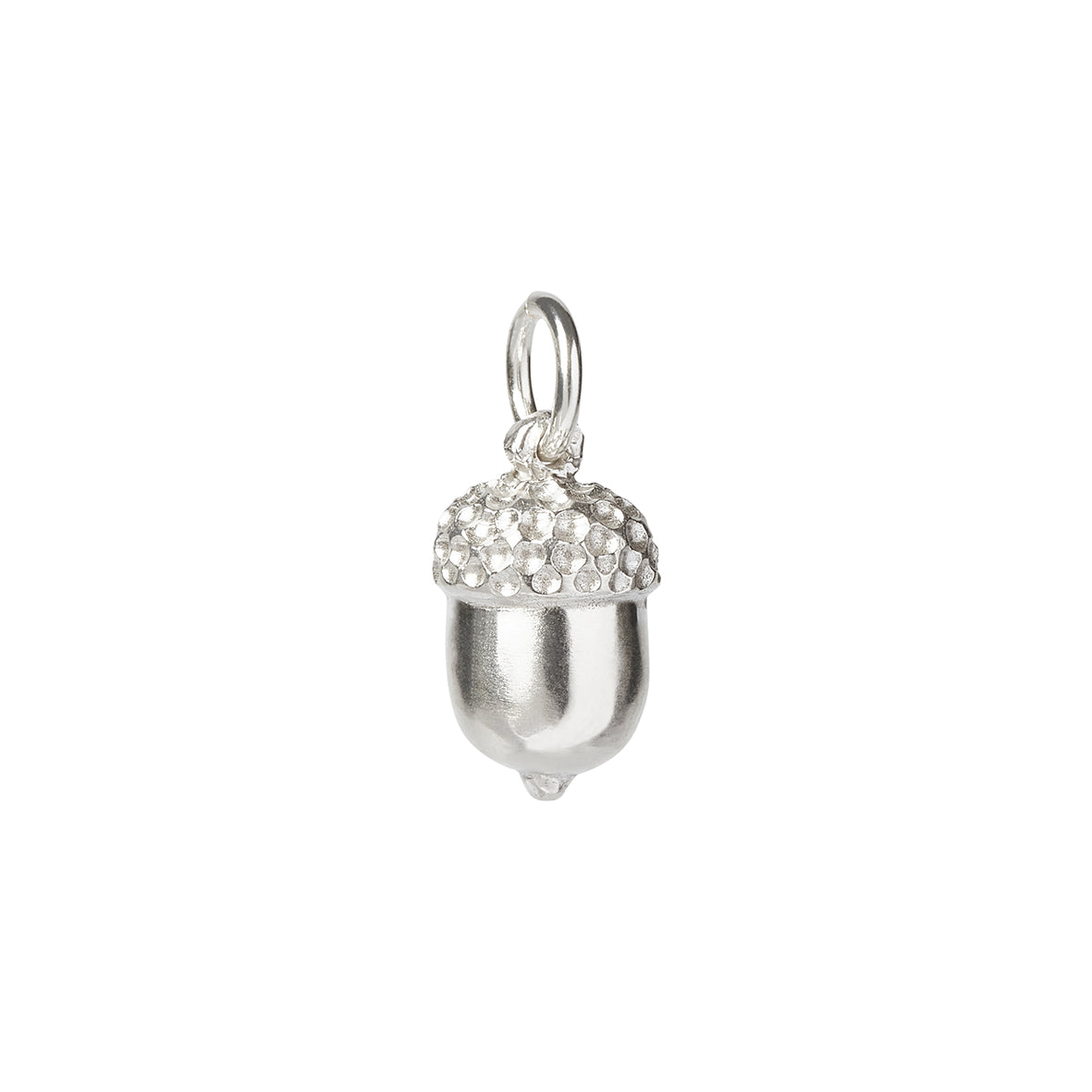 A solid sterling silver acorn with a textured top and jump ring on a white background. Made by Kirsty Taylor Jewellery in Corbridge Northumberland