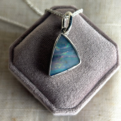 Opal pendant on a chain in a jewelry box