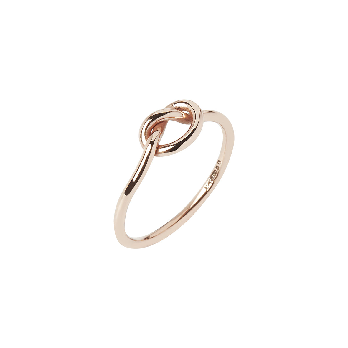 9ct rose gold proposal love knot ring on white background. Handcrafted promise ring made in Corbridge, Northumberland by Kirsty Taylor Goldsmiths