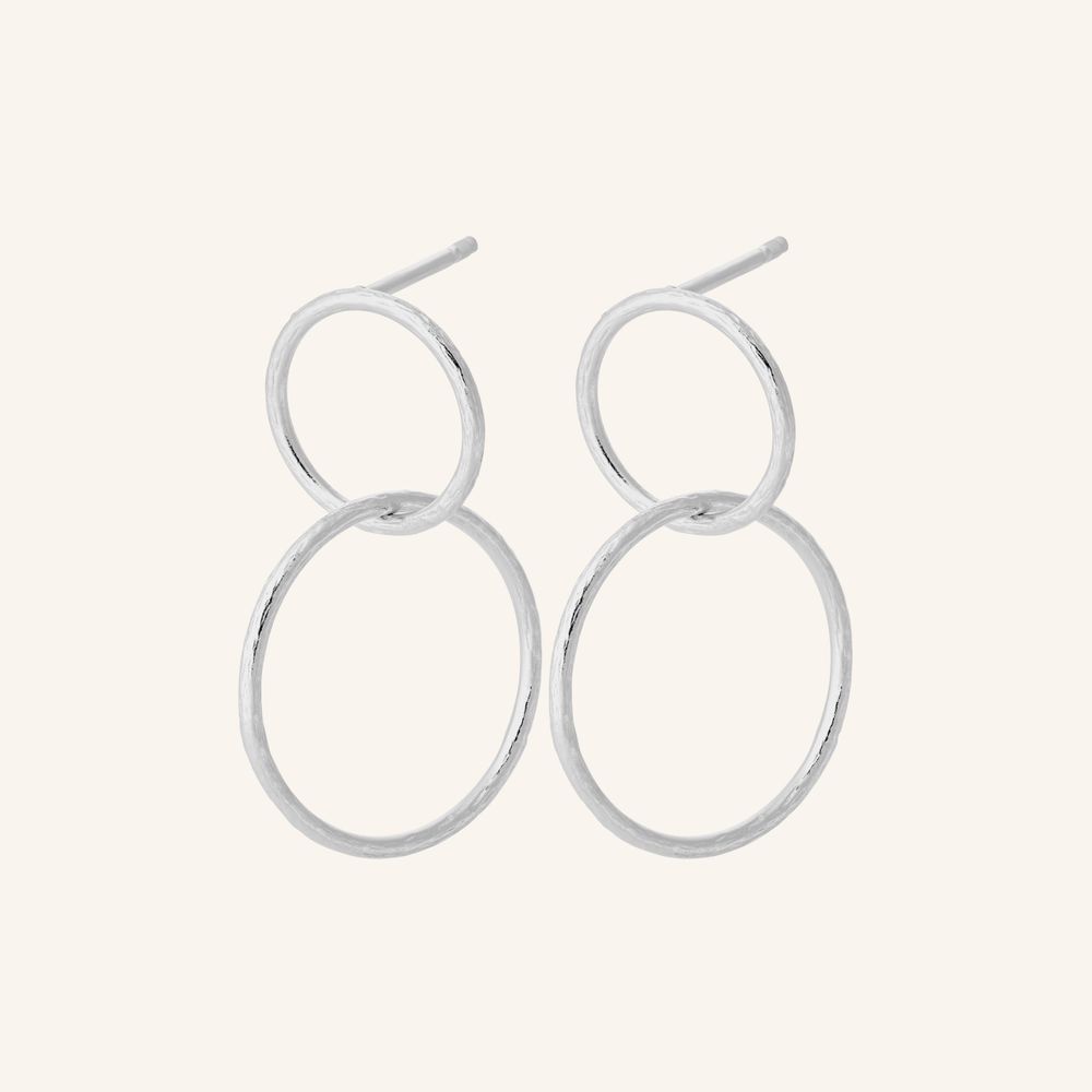 Silver hoop earrings on a white background