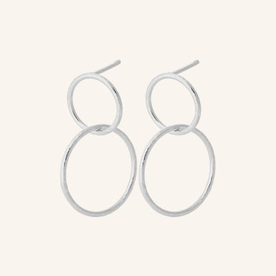 Silver hoop earrings on a white background