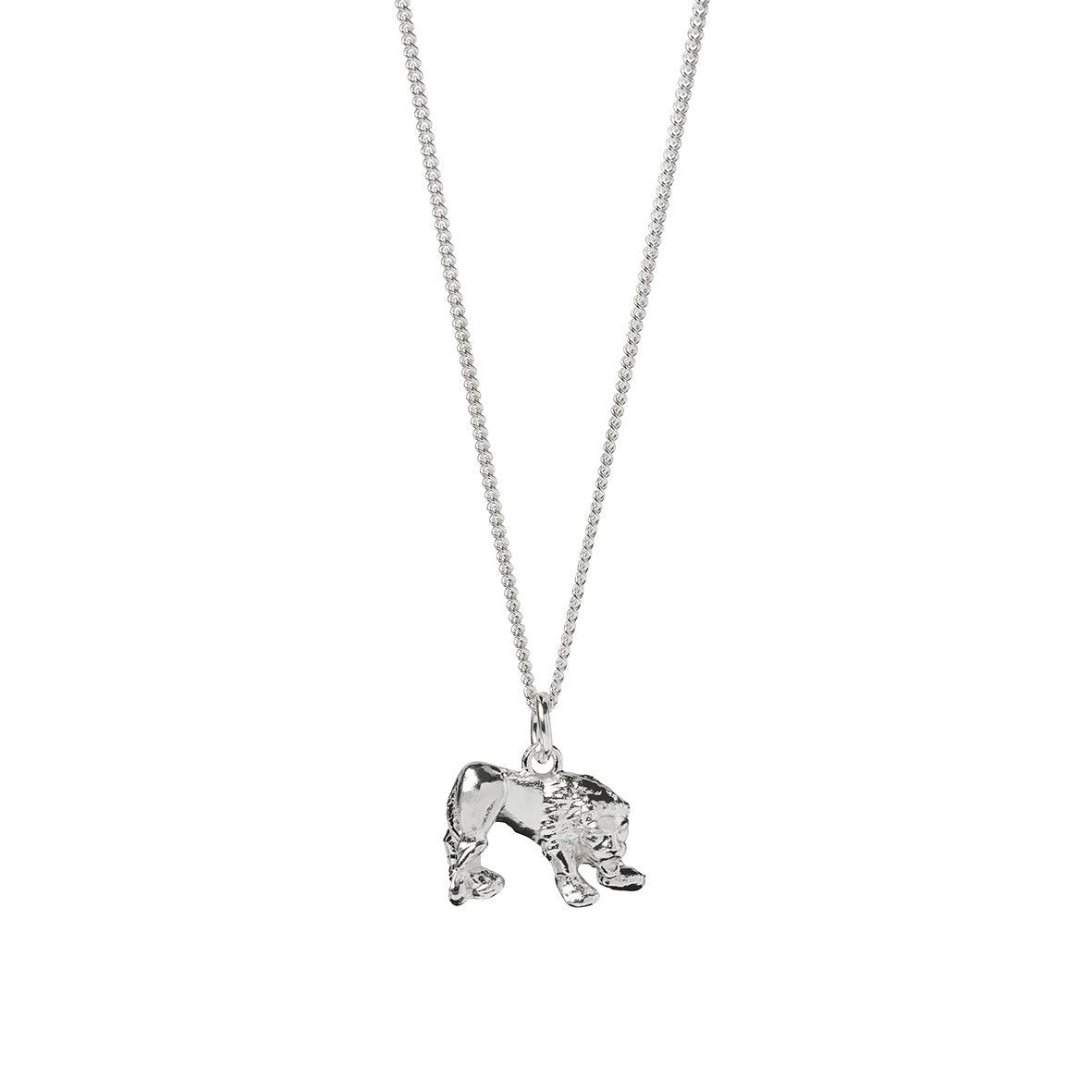 A silver lion pendant based on the Corbridge Lion statue found at Corstopitum Corbridge Roman Site in Northumberland, handmade by Kirsty Taylor Goldsmiths in Corbrige