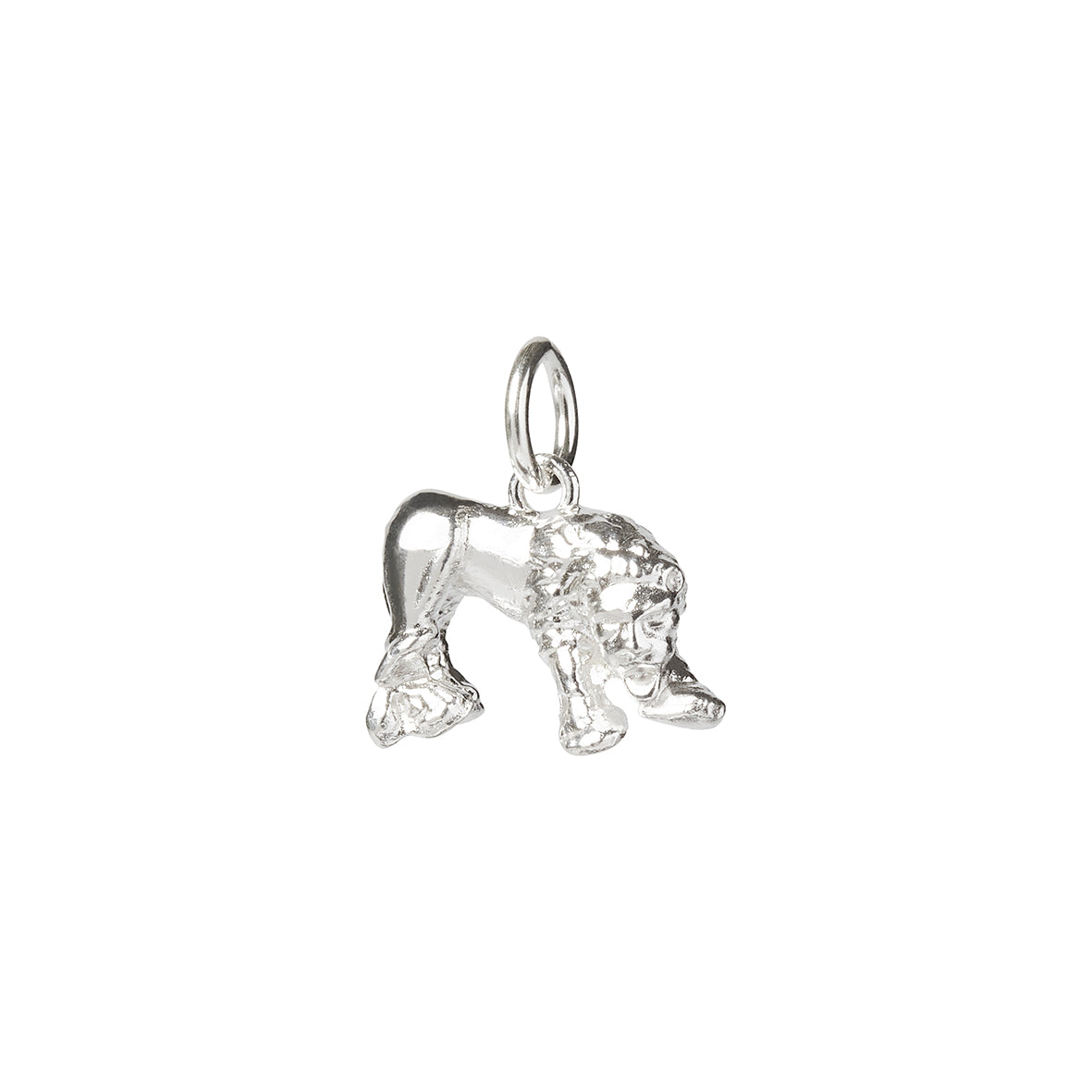 A silver charm of the Lion of Corbridge statue found at the Corbridge Roman site, a silver charm with a silver jump ring on a white background made by Kirsty Taylor Goldsmiths, Corbridge Northumberland