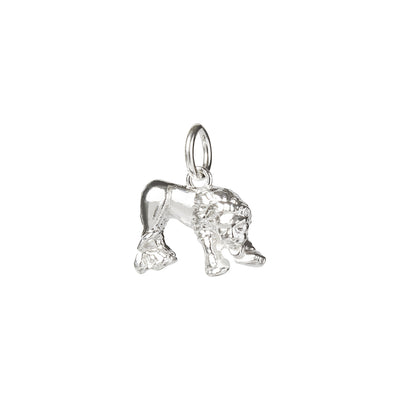 A silver lion charm on a white background made by Kirsty Taylor in Corbridge Northumberland