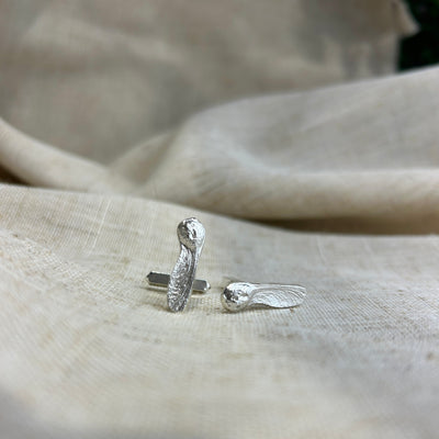 Silver Sycamore Cufflinks  on a beige fabric background handcrafted Kirsty Taylor Jewellery