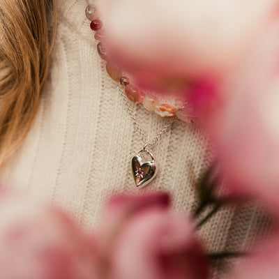 Sliver heart pendant with star set ruby ons silver chain.